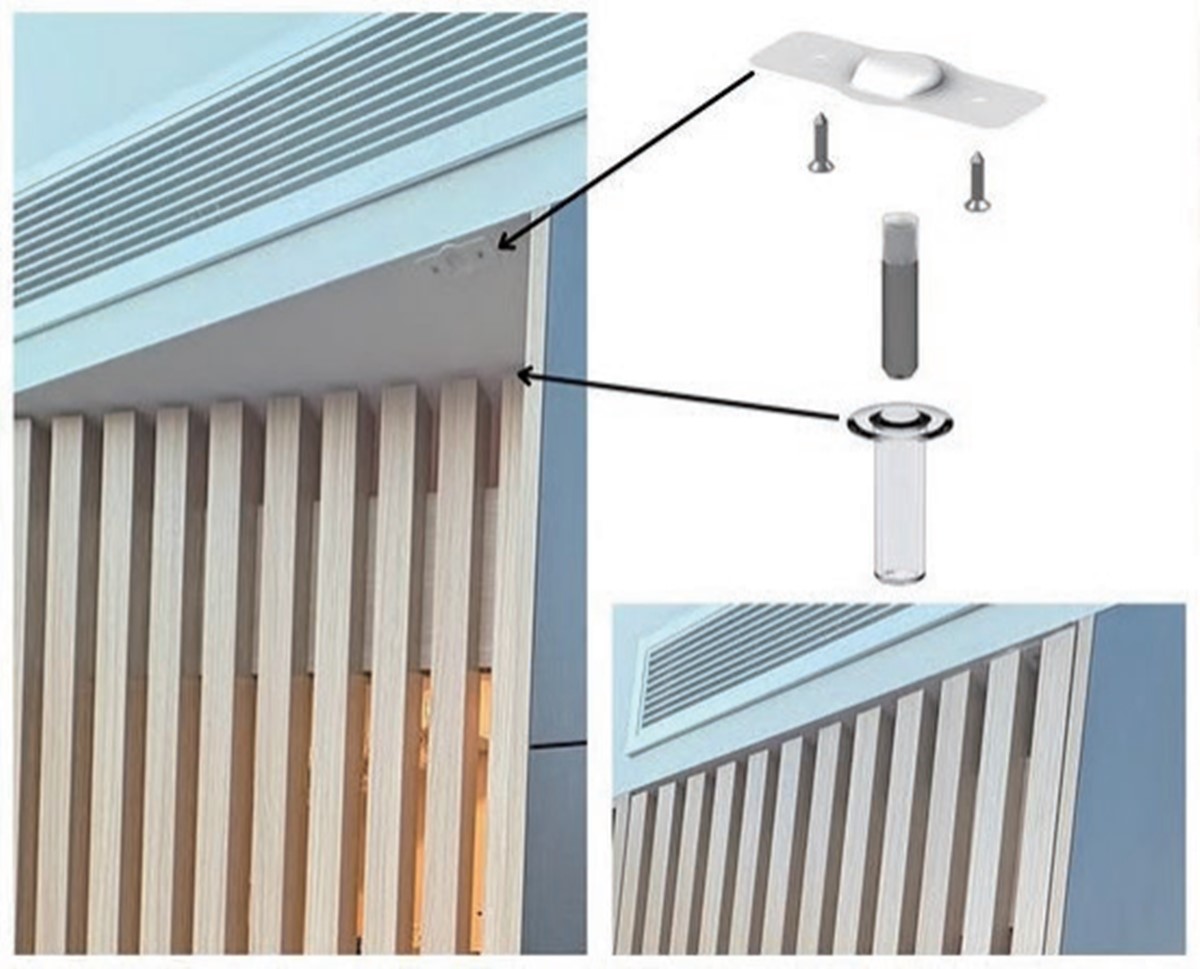 Door stop mounted at the top of the door