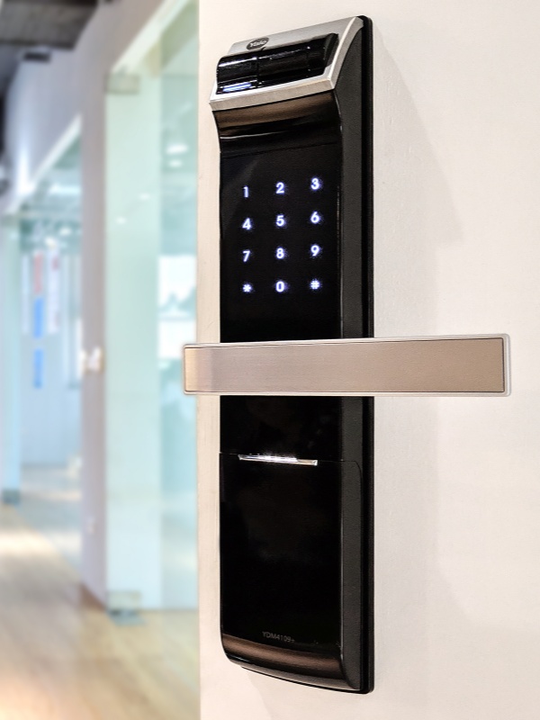 Modern electronic smart door lock installed on a secure entry door